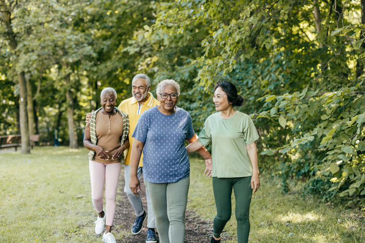 a group of elderly individuals walking and conversing