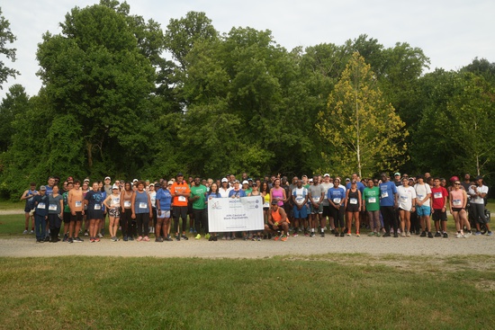 participants pose in group photo at the 2024 Moore Equity in Mental Health 5K