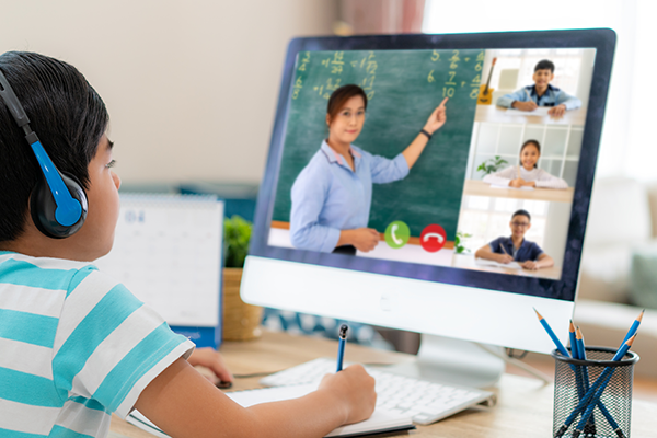 Child on computer attending a virtual class